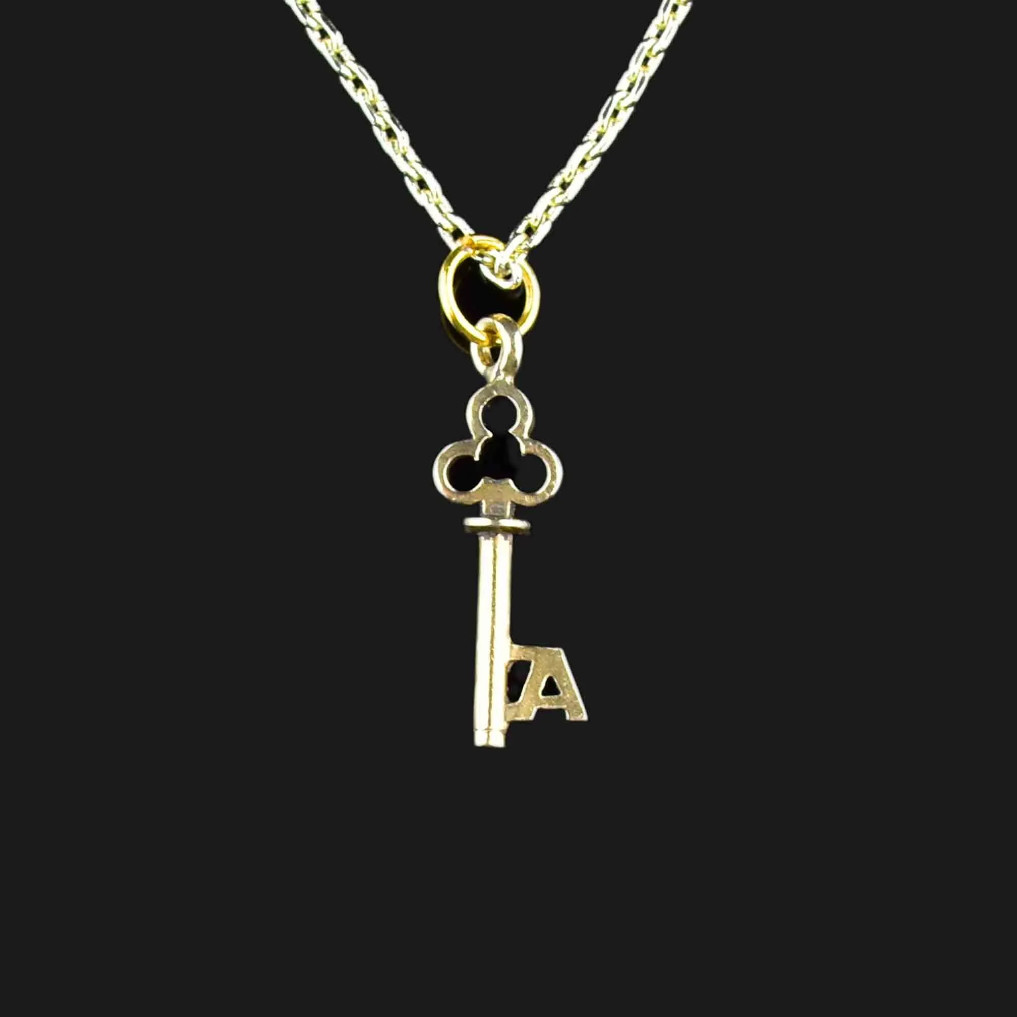 A Monogram Skeleton Key Necklace in 14K Gold