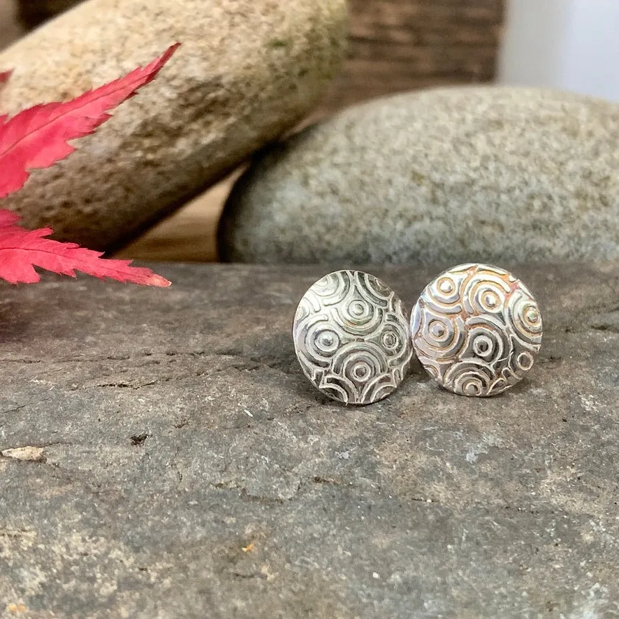 Silver textured round stud earrings