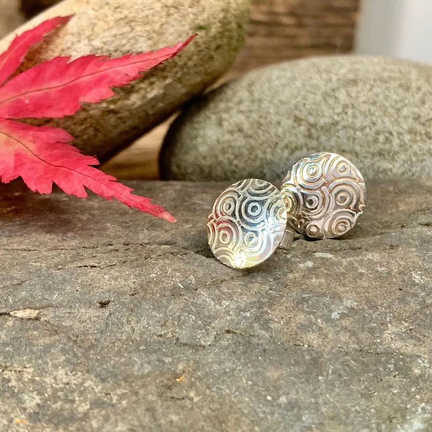 Silver textured round stud earrings