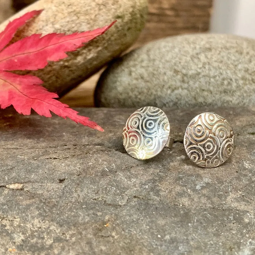 Silver textured round stud earrings